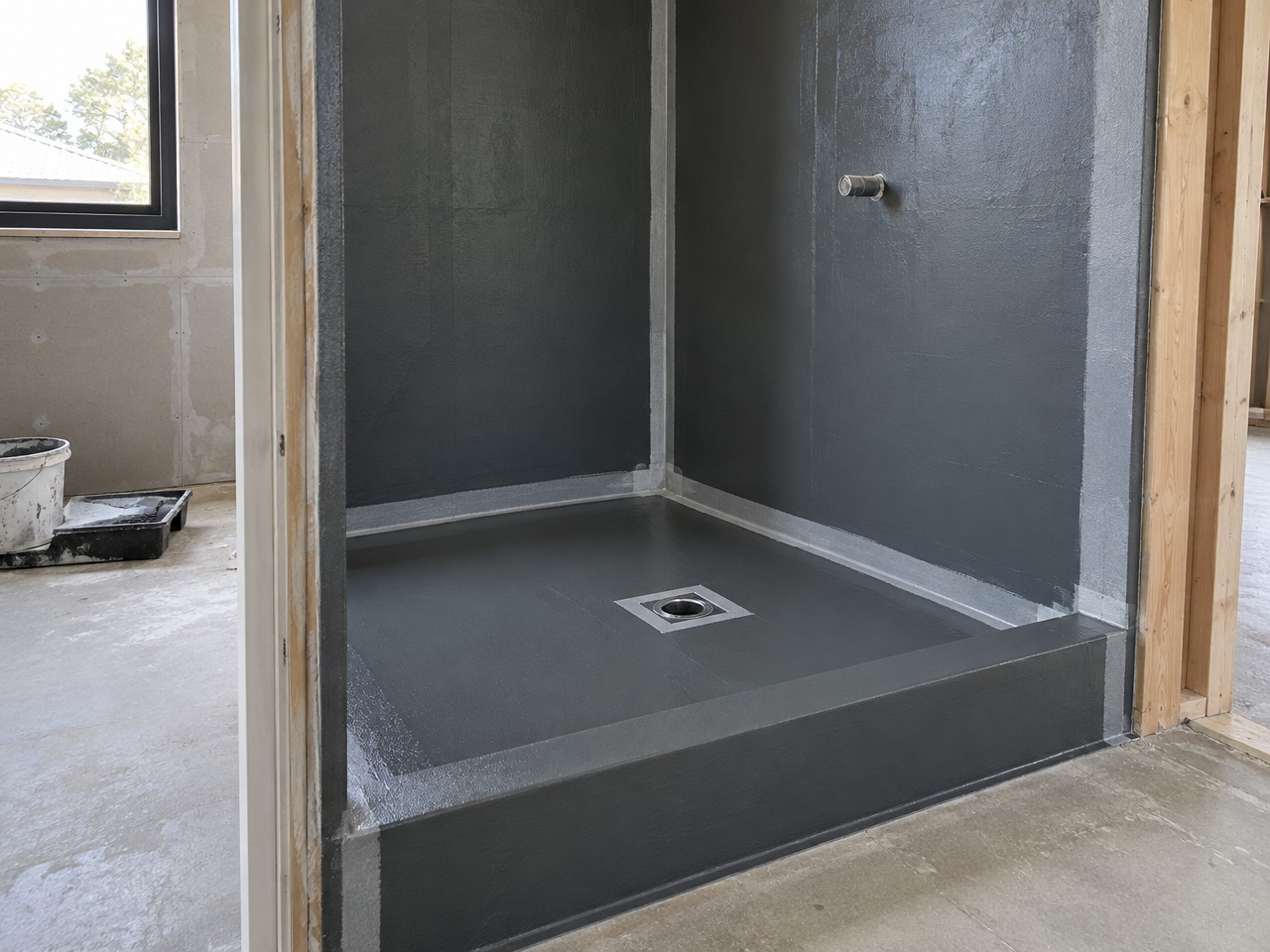 Illustrative image: waterproofing membrane in a shower recess during renovation